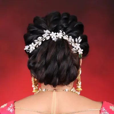 A detailed view of an elegant and intricate bridal bun. This is one of the 10 professional hairstyles that I teach in my 30-day course, perfect for brides and special occasions.