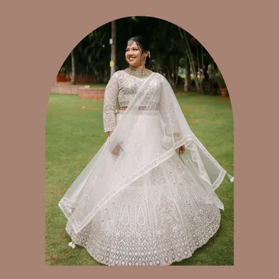 A beautiful portrait of the bride-to-be, radiant in her white engagement lehenga. We take the time to capture these solo shots, celebrating the individual before they become part of a pair.