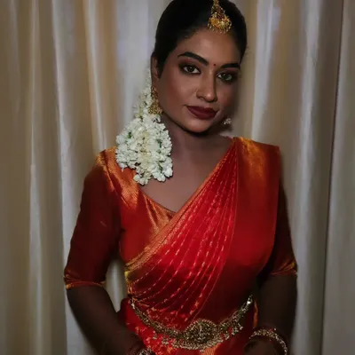 Radiant in tradition. For this stunning bridal look, I embraced the beauty of her dusky, highly pigmented skin with a flawless matte finish. The deep reds and golds create a regal and timeless vibe.