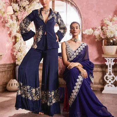 An elegant group shot for designer Krisha Sunny Ramani. I created complementary makeup looks that enhance the models' features while harmonizing with the deep blue tones of their embroidered couture outfits.