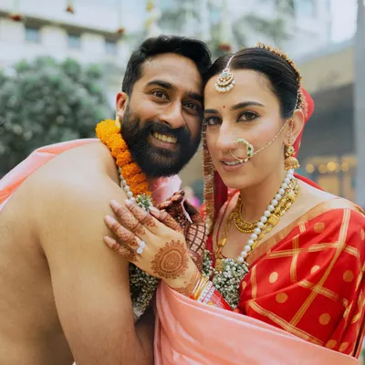 A beautiful portrait of a South Indian bride and groom, capturing their joy and traditional attire.