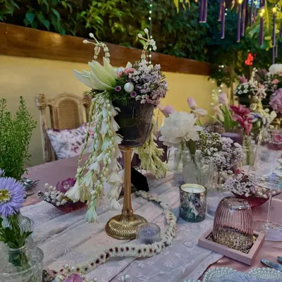 An exquisite and intimate sit-down birthday dinner I designed for Anushka Sharma. The tablescape features cascading white florals, delicate baby's breath, and a romantic color palette of lavender and pink, creating a truly magical setting.