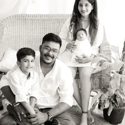 A beautiful black and white portrait of the complete family. We coordinate poses that feel natural and highlight the joy of having a new member in the family.