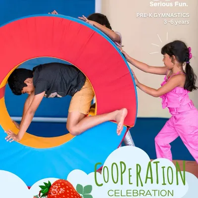 It takes a team. Children work together to move our large, soft wheel, learning valuable lessons in cooperation and problem-solving.