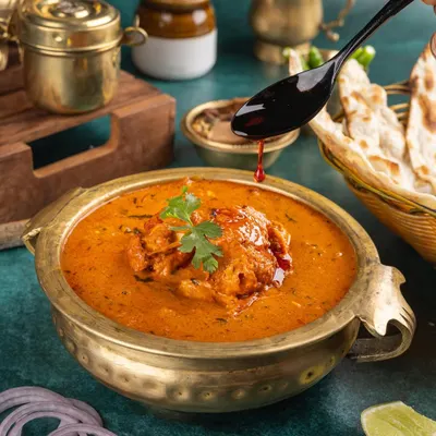 I love capturing action in my stills. That final drizzle of chili oil over a rich Indian curry adds drama and makes the dish come alive, highlighting the texture and colour.