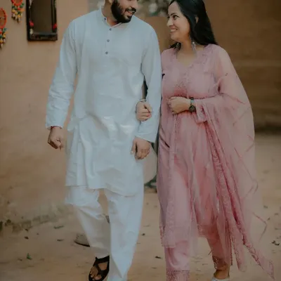 A couple in traditional Indian attire takes a romantic walk through our rustic village set. This backdrop provides an authentic and charming setting for culturally themed pre-wedding shoots.