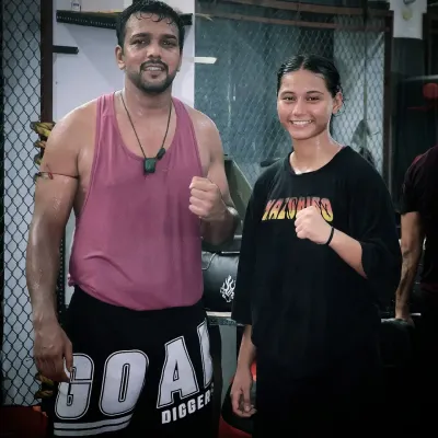 Posing with one of my dedicated female fighters after a tough training session. The attitude and hard work here are inspiring.