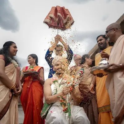 The Kashi Yatra is a beautiful and symbolic ritual. I captured the energy of the moment, with rice showering the groom, surrounded by his smiling family under a dramatic sky.