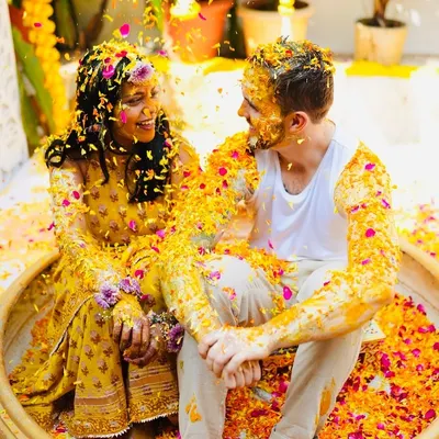 The Phoolon ki Holi is one of my favorite pre-wedding events. It's pure, uninhibited joy, as seen here at Sam and Matt's haldi, where they were showered with turmeric and flower petals by their loved ones.