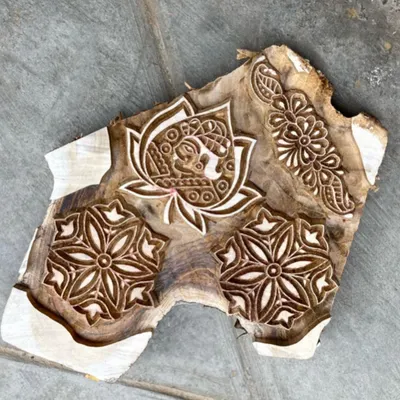 We believe in minimal wastage at every stage. This single piece of seasoned teak wood is carved with multiple designs, a testament to the skill and resourcefulness of our artisans. These blocks are built to last for generations.