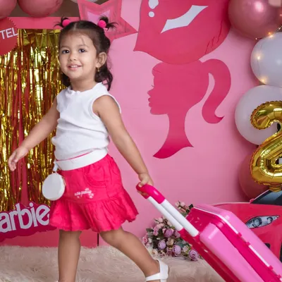 "Let's go shopping!" This little fashionista is ready to hit the stores in our super fun and girly Barbie-themed setup, complete with a pink car and shopping suitcase.