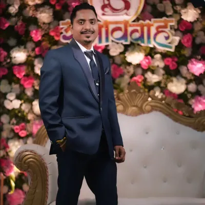 A dapper groom looking sharp in his reception suit. I provide subtle grooming and makeup to ensure the groom looks his absolute best and feels confident.