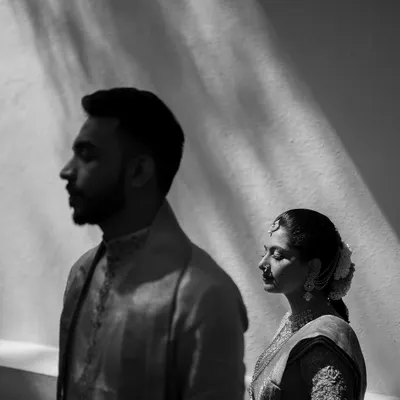 A powerful black and white portrait using dramatic shadows. We love playing with light to create artistic and emotive images that tell a deeper story.
