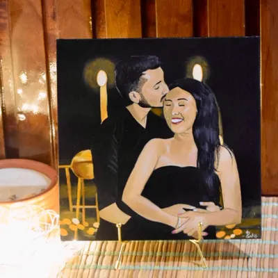 I painted this cozy couple's portrait as a custom wedding gift. It captures a warm, intimate moment, making it a truly personal and heartfelt present for the newlyweds.