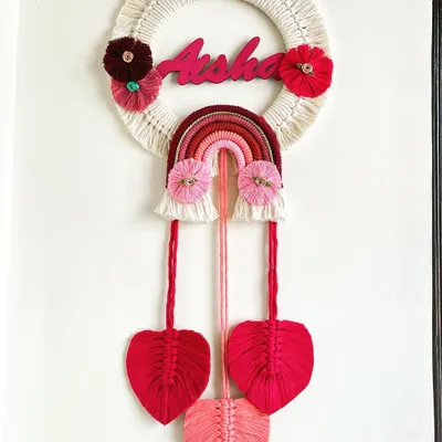 I adore making personalized gifts, and this name hanging for Aisha was a joy to create. Combining a custom nameplate with a rainbow and delicate macrame leaves makes for a perfect nursery decoration.