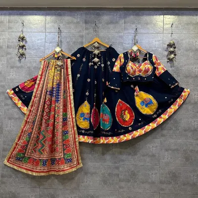 A stunning navy blue chaniya choli with vibrant, multi-colored elephant embroidery. The matching dupatta and blouse complete this beautiful set, available to rent or buy.
