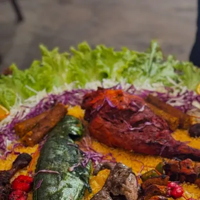 A colourful and appetizing platter of our mixed starters, featuring a variety of kebabs and grilled items. This is how I present food to make your event's main table look spectacular.