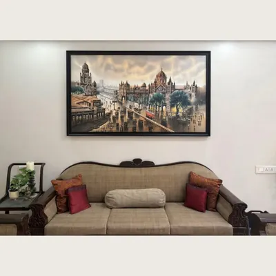 A magnificent cityscape of Mumbai finds its place above a classic sofa, adding historical depth and a sense of motion to this elegant living room.