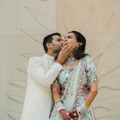 A playful and joyous moment from an engagement celebration. Capturing this spontaneous laughter is just as important as the formal ring exchange, as it shows the true happiness of the day.