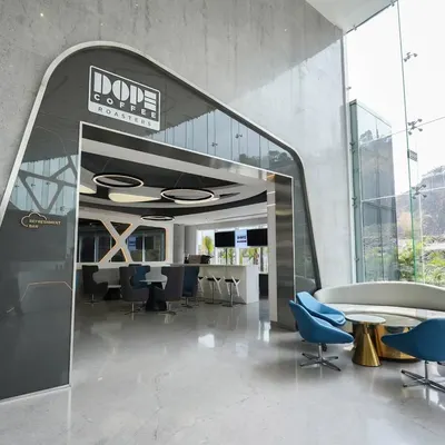 An establishing shot for a commercial project with Architect Reza Kabul, capturing the striking entrance of Dope Coffee Roasters. My goal here was to create a powerful first impression, highlighting the modern, futuristic archway and giving a glimpse of the sleek interior waiting inside.