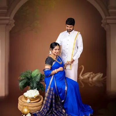 A stunning fine-art maternity portrait inspired by classic paintings. The rich blue saree and traditional South Indian attire create a regal and timeless image.