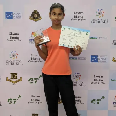 One of our star players from the Chembur Gymkhana center posing with her bronze medal and certificate from the Yonex Sunrise Gautam Thakkar Memorial Sub-Junior Badminton Tournament.