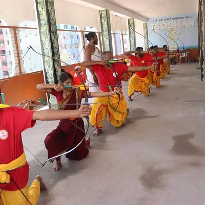 A line of archers, united in purpose. I guide my students to find their stance, to feel the ground beneath them, and to draw the string as a single, focused unit. This is a lesson in both individual form and collective energy.