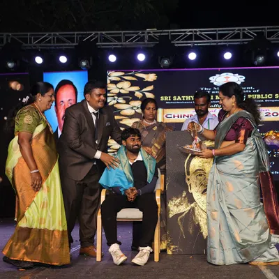 A moment of felicitation after a live painting performance. It is always an honor to be recognized for my work, especially when I can share it with a wonderful audience.