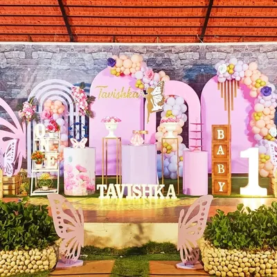 This grand butterfly-themed first birthday for Tavishka features a stunning pink and lavender setup. I used large butterfly wing cutouts, arched backdrops, and delicate balloon garlands to create a truly enchanting garden atmosphere.