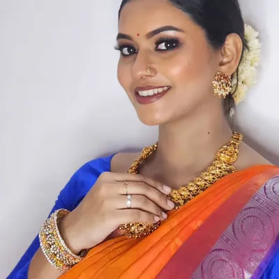 An elegant and timeless look for a photoshoot. The soft smokey eye and glowing skin are perfect for capturing beautiful portraits.