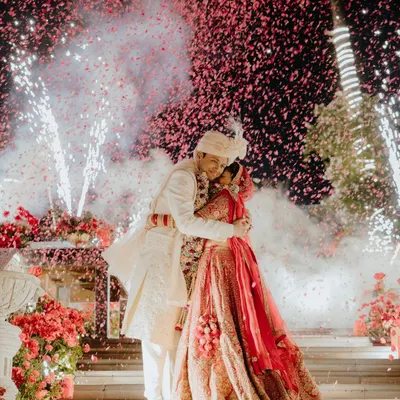 A grand Varmala moment captured with an explosion of fireworks and confetti. We ensure the most pivotal moments of your ceremony are framed with spectacular flair.