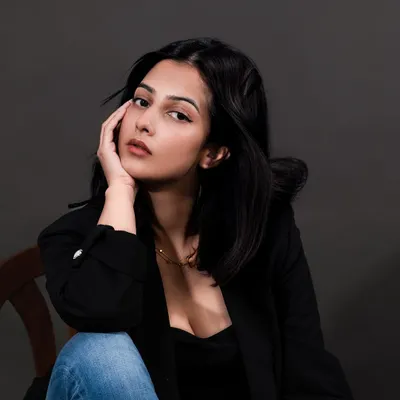 An on-model portrait showcasing a delicate necklace. This type of lifestyle jewelry photography helps customers envision themselves wearing the piece and understand its scale and style.