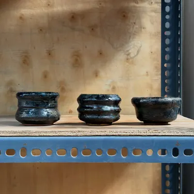 A set of three multi-purpose bowls, perfect for tea, snacks, or dips. Each bowl shows unique characteristics from being gas-fired and then re-fired in a wood kiln, creating beautiful, layered glazes.