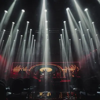 To achieve a simple yet dramatic look for this Sangeet, we used 92 super sharpy lights to create this incredible impact. The all-black suede chairs and mirror flooring completed the moody, sophisticated atmosphere.