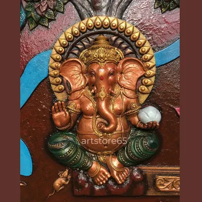 This close-up of a Ganesha sculpture shows the warm, metallic finish and detailed craftsmanship. We focus on creating a divine presence, capturing details like the modak in his hand and the serene expression, making it a perfect centerpiece for worship.