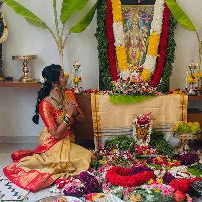 Dressed in a traditional saree, I find a deep connection between my culture and my yoga practice. Here I am in a moment of prayer during a family pooja.