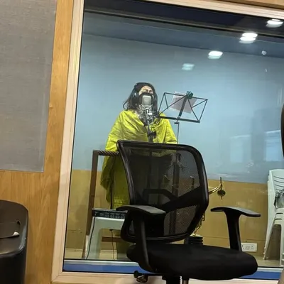 A view from the control room into the recording booth at LM Studio. This is my space of complete focus, where I connect with the lyrics and melody to deliver an emotional vocal performance.
