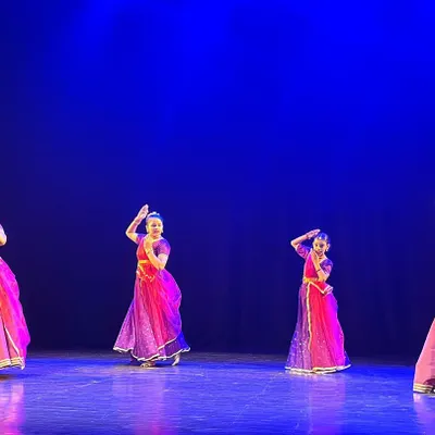 A group of our senior Kathak students performing a complex piece at our annual show. The vibrant costumes and synchronized movements reflect months of dedicated practice and teamwork.