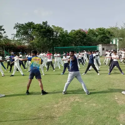 A yoga session in progress on our grounds. We incorporate yoga into our training regimen to improve flexibility, balance, and mental focus, which are crucial for a cricketer's overall performance.
