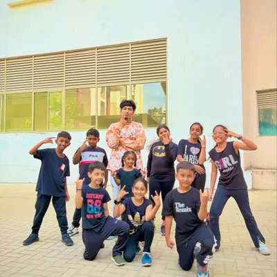 Our kids' batch posing with their instructor after a great class. We're always working on something new and exciting for them to perform.