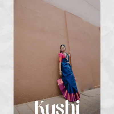 A full-length editorial portrait for a model's book. The strong pose, vibrant saree, and minimalist background create a high-fashion look.