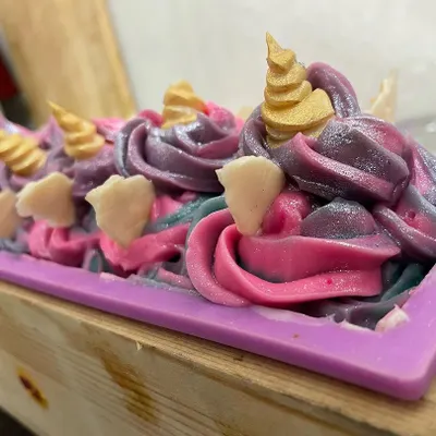 A full loaf of my Unicorn soap, freshly frosted and decorated with soap embeds. This is a cold process soap that smells like a real cupcake.