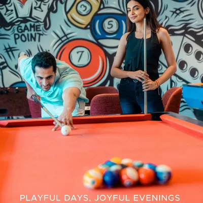 Playful days, joyful evenings. Our recreation zone, Kridha, offers a lively space for friendly competition with a game of pool on our vibrant red table.