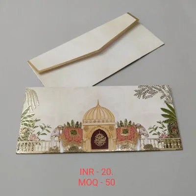 This elegant shagun envelope features a traditional palace design with decorated elephants, finished with gold foil. It's the perfect way to present your blessings at a royal-themed wedding.