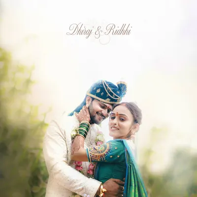 An ethereal and romantic portrait of a Maharashtrian couple on their wedding day. The soft lighting and gentle embrace create a dreamy, timeless feel.