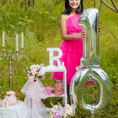 From her first birthday to her tenth, we have had the honor of capturing this young lady's journey. This portrait from her tenth birthday shoot showcases our long term milestone packages, designed to document your child's growth over the years.