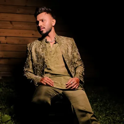 For this groom's evening look, we went with a sharp fade and precise beard trim. This style looks great in photos and holds up through all the wedding festivities.