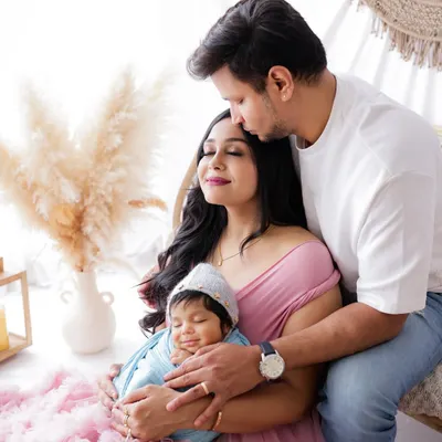 A beautiful first portrait as a family of three. I guide you into comfortable, natural poses that let your love for each other and your new baby shine through.
