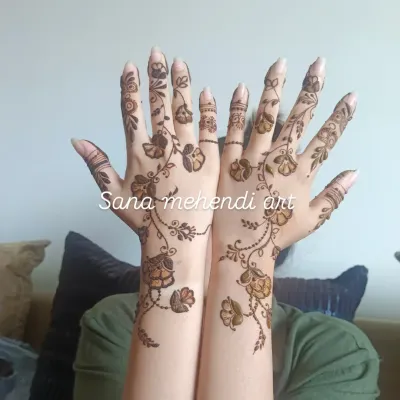 A beautiful floral vine design that gracefully flows from the forearm down to the fingers. This Arabic-inspired style is elegant and leaves some skin showing for a modern look.