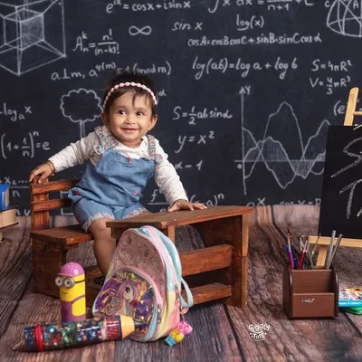 Welcome to Miss B's class! This little scholar is ready to teach us a thing or two in our fun "back to school" themed setup.
